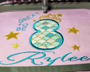 Custom birthday embroidery featuring number 8 and name Rylee