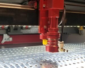 High-precision CNC laser engraving machine head performing custom cutting