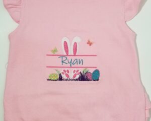 Custom embroidered pink ruffled baby shirt with Easter bunny ears and name Ryan